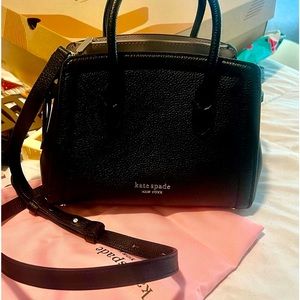 Kate spade purse with long strap.